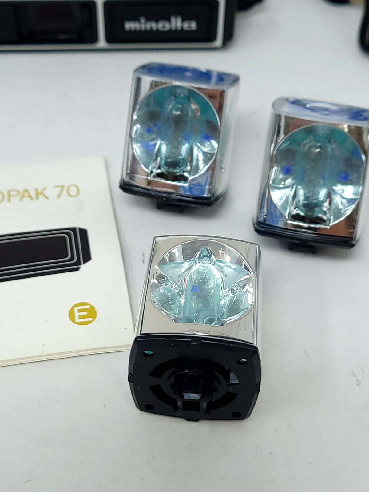Vintage Minolta pocket autopak 70 - with flash cubes, stand, and manual